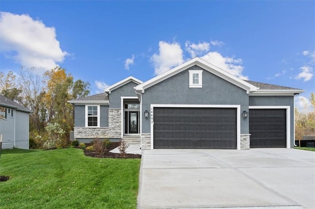 view of front facade featuring stucco siding, driveway, a front lawn, stone siding, and an attached garage