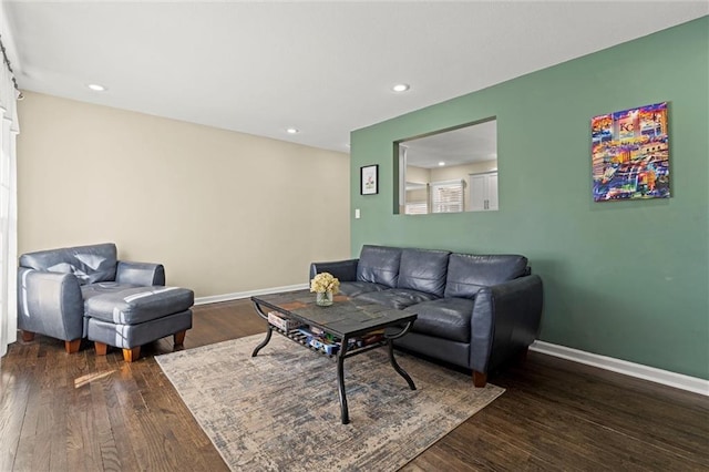 living area featuring recessed lighting, wood finished floors, and baseboards