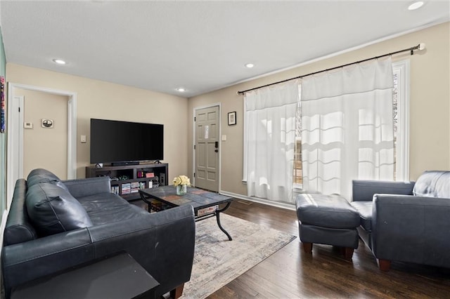 living room with wood finished floors and recessed lighting