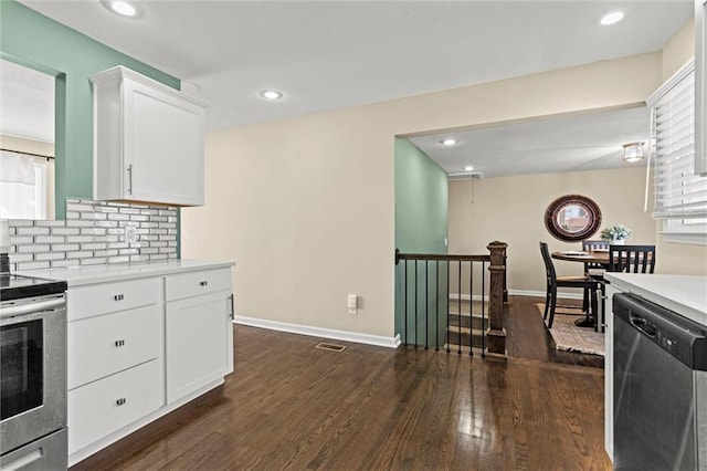 kitchen with stainless steel appliances, tasteful backsplash, light countertops, and dark wood-style floors