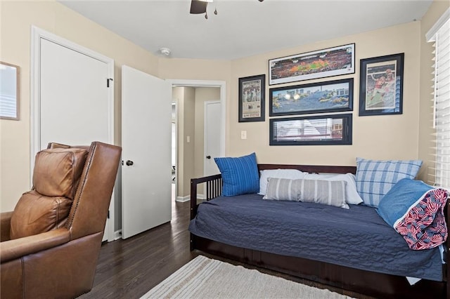 bedroom with a ceiling fan and wood finished floors