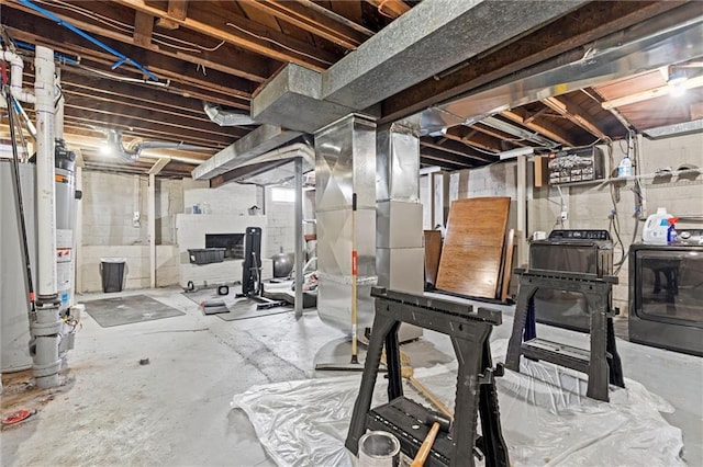 workout room featuring water heater and independent washer and dryer