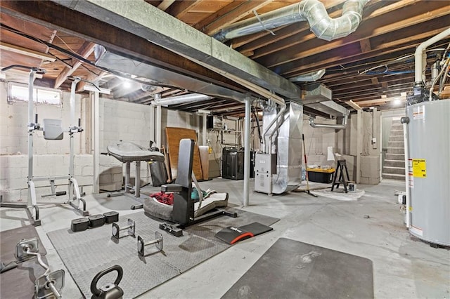 workout room featuring water heater and heating unit