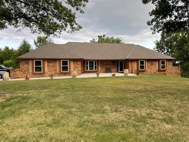 ranch-style home with a front lawn