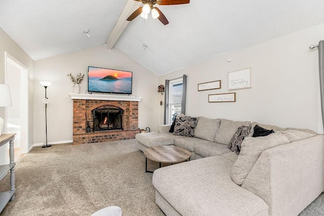 carpeted living room featuring lofted ceiling with beams, a brick fireplace, baseboards, and a ceiling fan