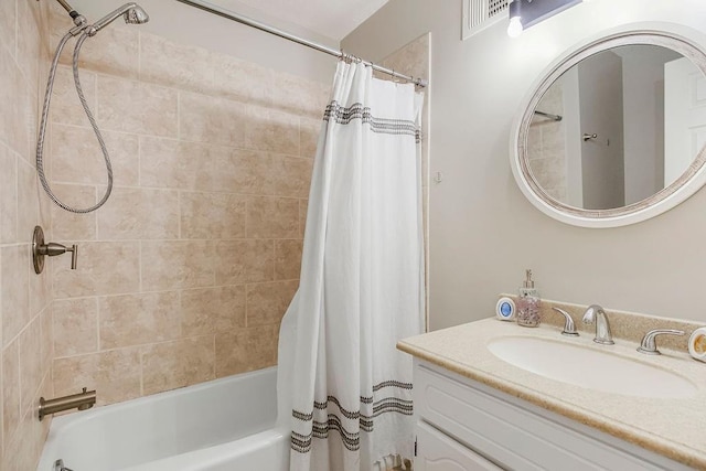 full bath featuring vanity and shower / tub combo with curtain