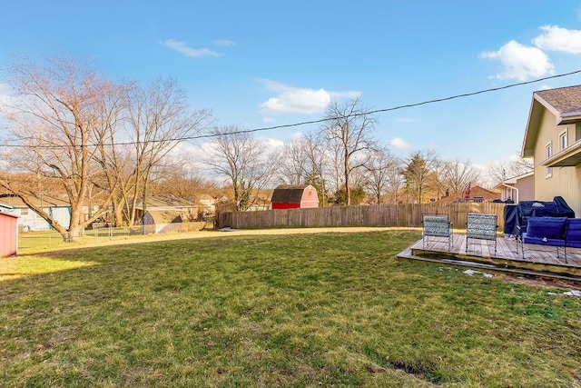 view of yard featuring fence and a wooden deck