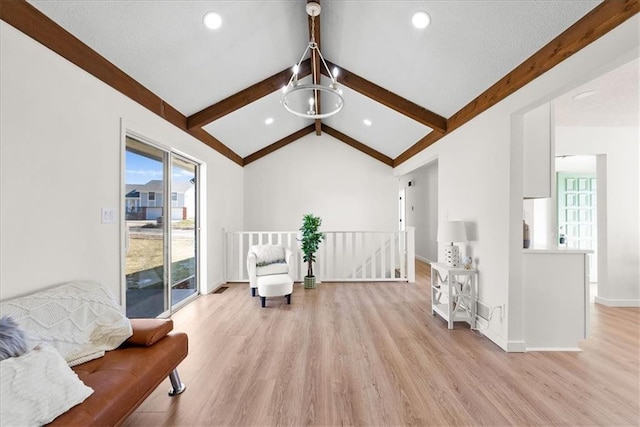 sitting room featuring lofted ceiling with beams, recessed lighting, an upstairs landing, baseboards, and light wood-type flooring