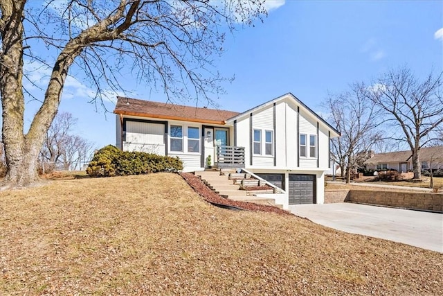 view of front of house with concrete driveway and an attached garage