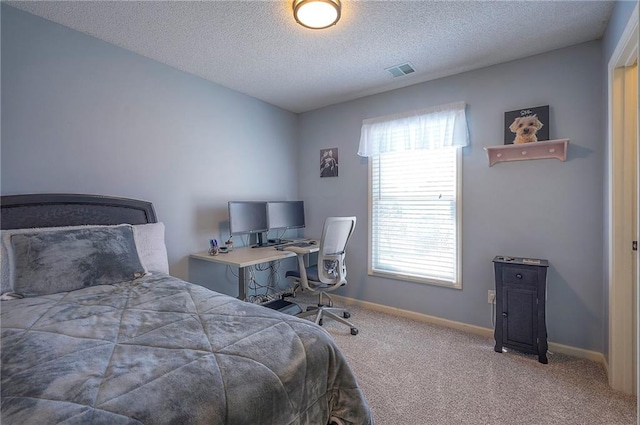 bedroom featuring visible vents, carpet floors, a textured ceiling, and baseboards