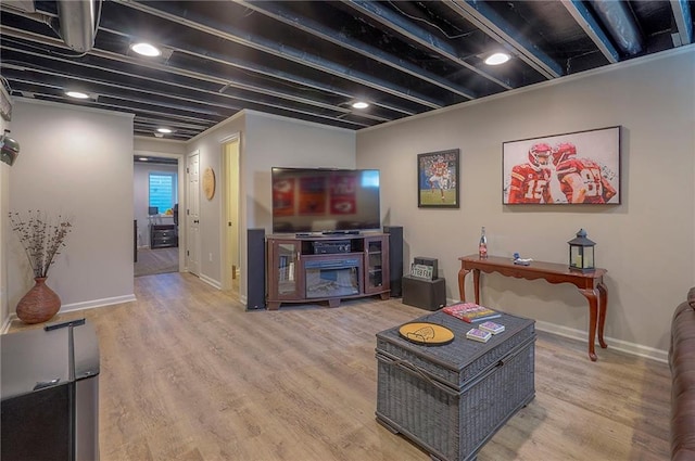 living room featuring wood finished floors and baseboards