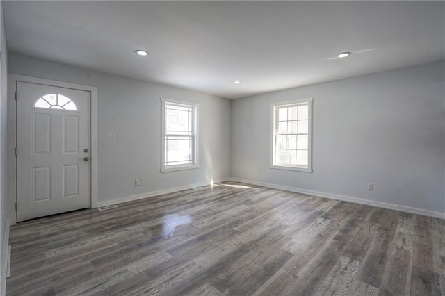 entryway featuring plenty of natural light, baseboards, dark wood finished floors, and recessed lighting