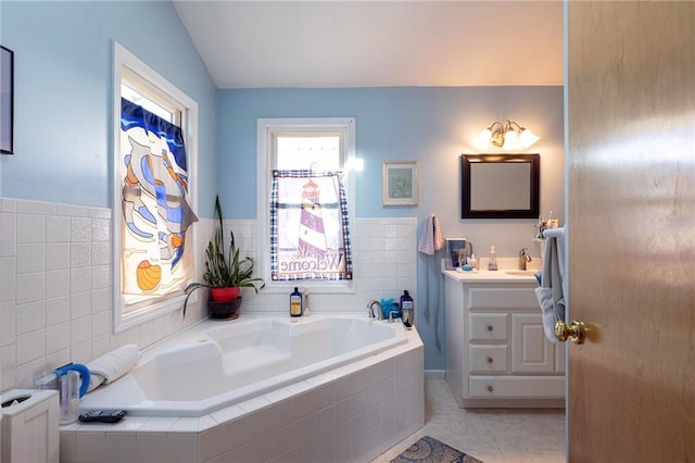 full bath featuring tile patterned floors, a bath, vanity, and radiator heating unit