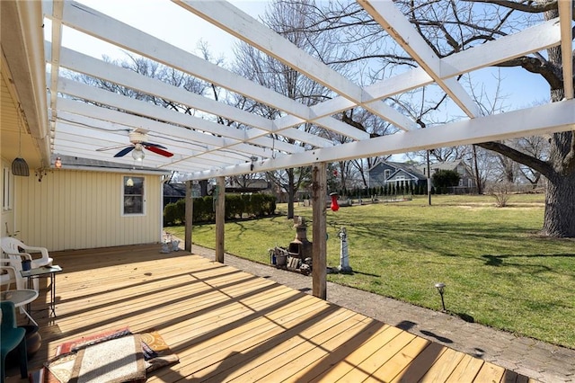 wooden terrace featuring a yard