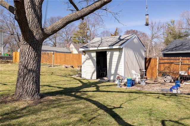 view of shed with a fenced backyard