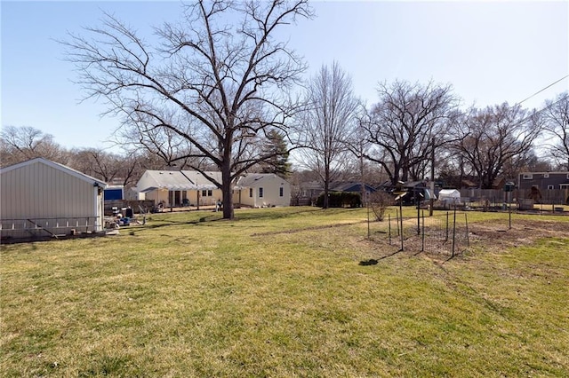 view of yard featuring a residential view and fence