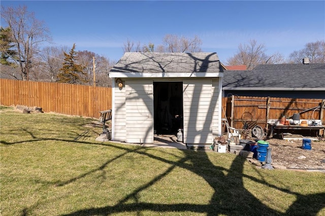 view of shed with a fenced backyard