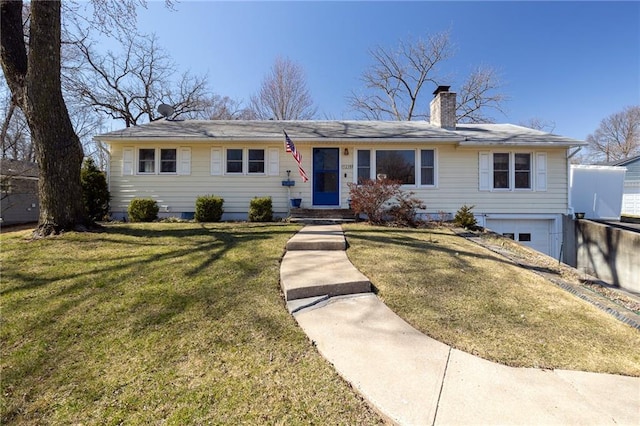 ranch-style home with a garage, a chimney, and a front lawn