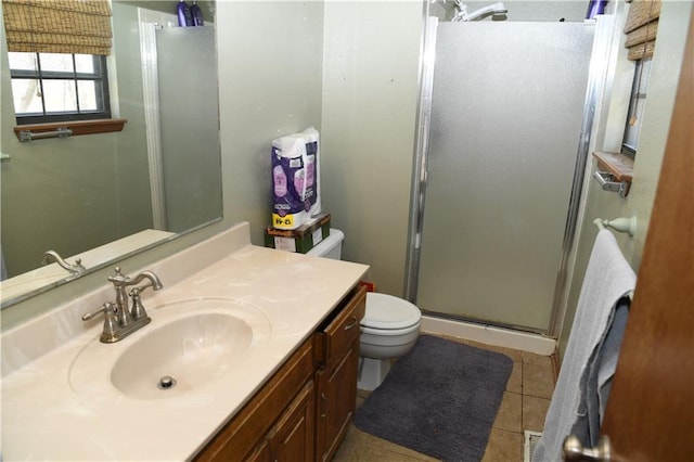 full bathroom with toilet, a stall shower, vanity, and tile patterned flooring