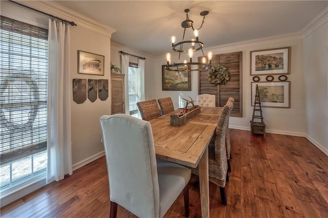 dining space featuring ornamental molding, a chandelier, baseboards, and dark wood-style floors