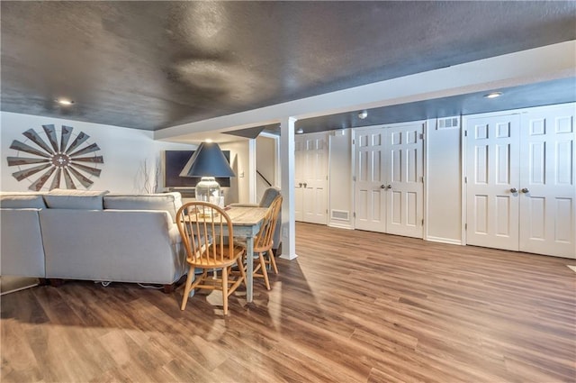 dining space featuring visible vents and wood finished floors