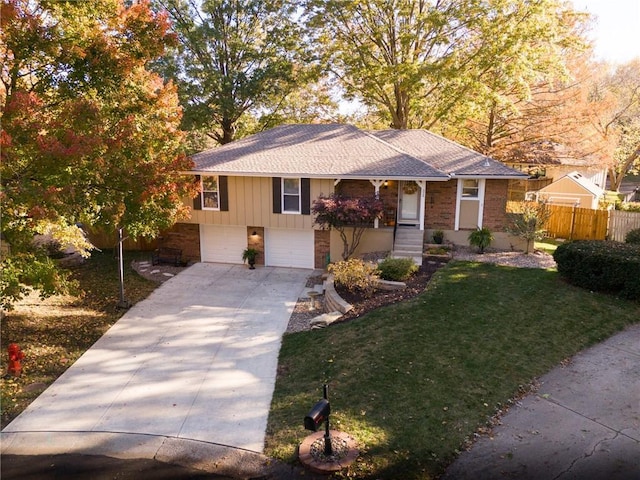 view of front of property featuring brick siding, concrete driveway, an attached garage, fence, and a front yard