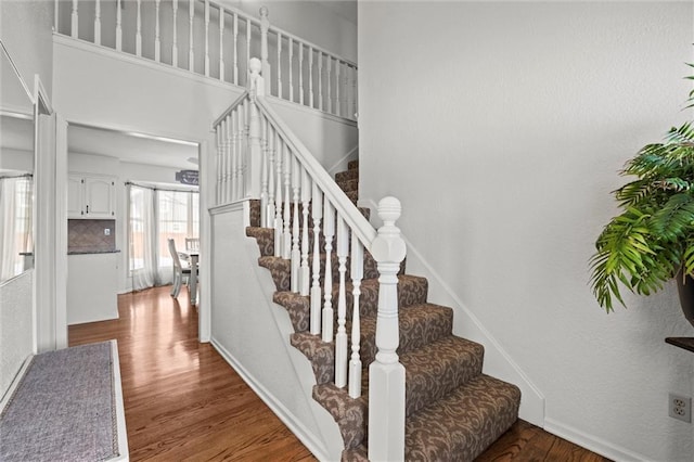 stairs with wood finished floors