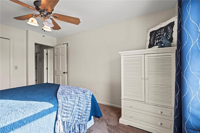 carpeted bedroom featuring baseboards, visible vents, and ceiling fan