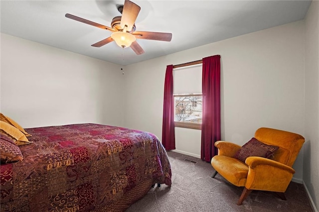 bedroom featuring baseboards, ceiling fan, visible vents, and carpet flooring