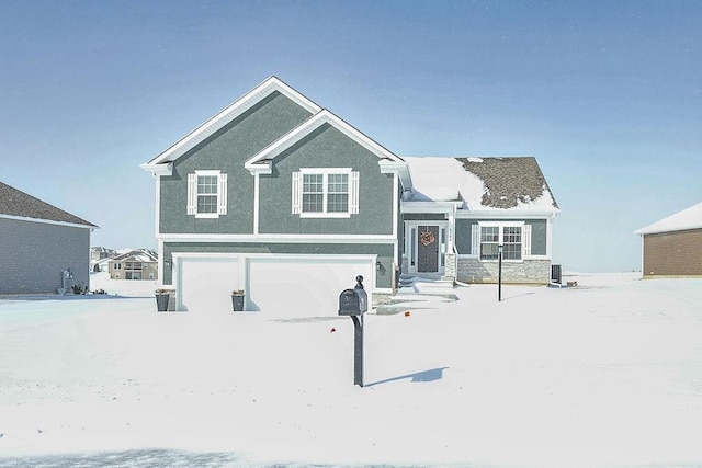 view of front of house featuring an attached garage and stucco siding