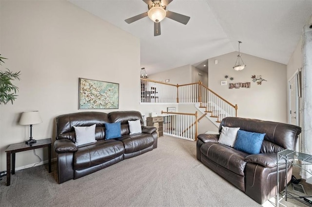 living area featuring baseboards, ceiling fan, stairway, carpet flooring, and high vaulted ceiling