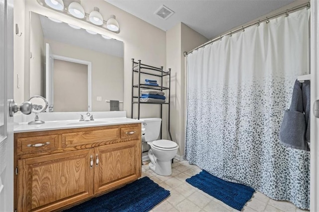 full bathroom featuring toilet, tile patterned flooring, vanity, and visible vents