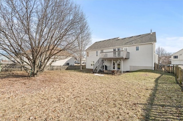 back of house featuring a yard, a fenced backyard, stairs, and a wooden deck