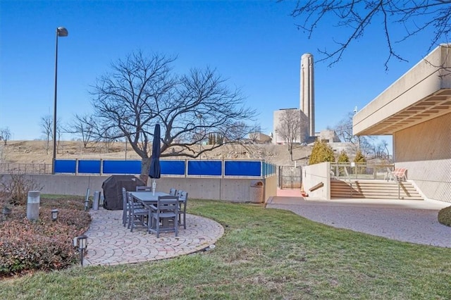 view of yard featuring a patio and fence