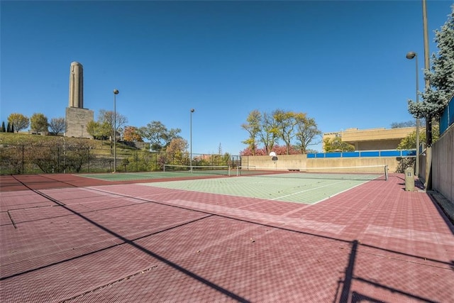 view of sport court with community basketball court and fence