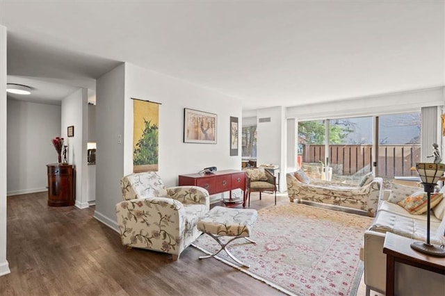 living room with wood finished floors and baseboards