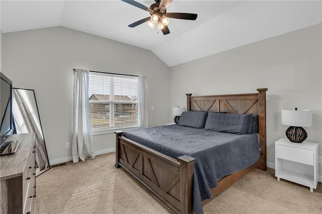 bedroom with lofted ceiling, baseboards, and light colored carpet