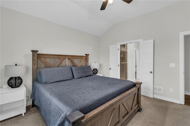 bedroom with lofted ceiling, light carpet, a ceiling fan, visible vents, and baseboards