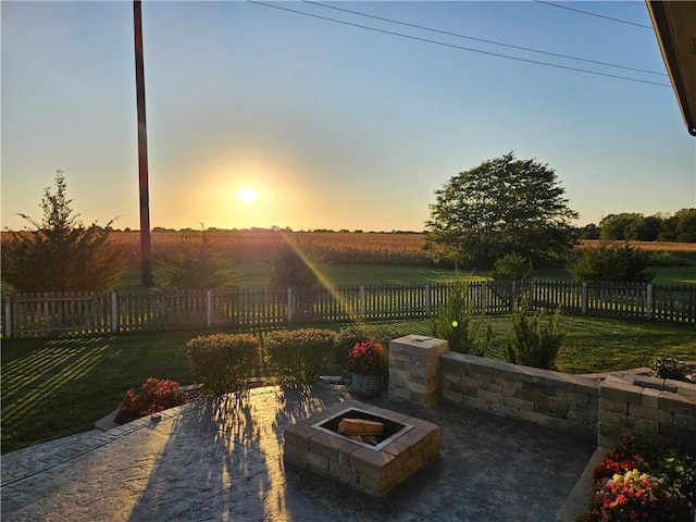 view of patio / terrace with a fenced backyard and a fire pit