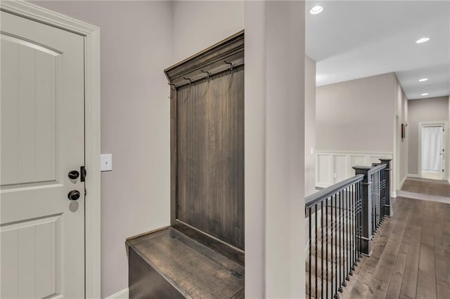 mudroom featuring recessed lighting, a wainscoted wall, a decorative wall, and wood finished floors