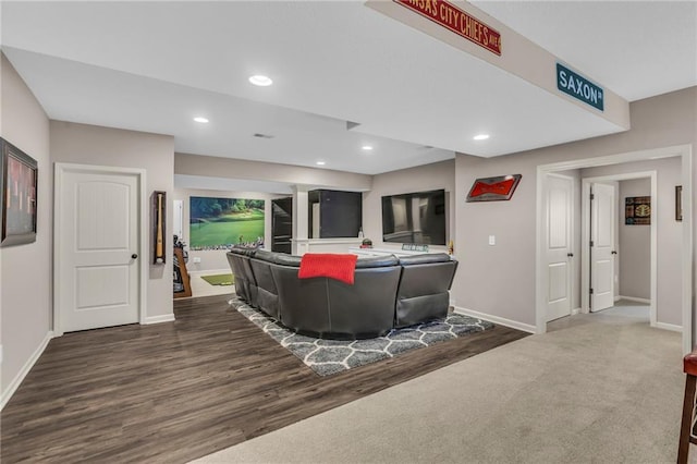 living room with recessed lighting, baseboards, and wood finished floors