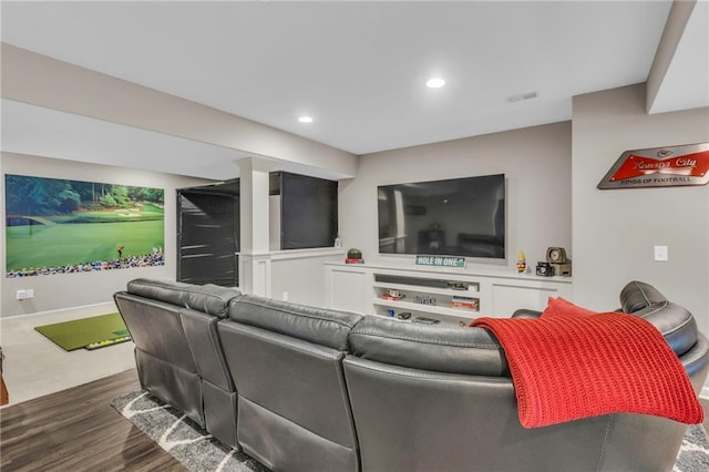 living area with dark wood-style floors and recessed lighting