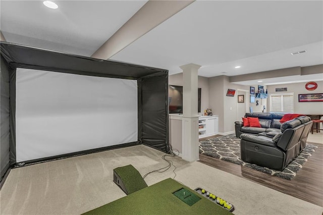 living room featuring golf simulator, recessed lighting, visible vents, wood finished floors, and baseboards