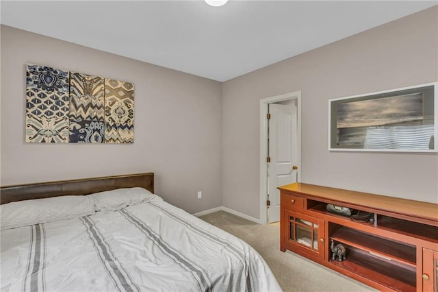 carpeted bedroom with baseboards