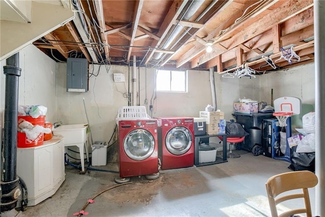 basement with washing machine and dryer and electric panel