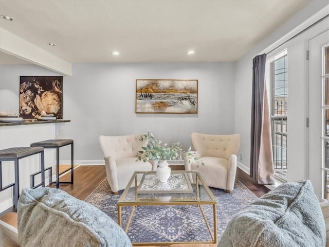 living room with dark wood-style floors, baseboards, and recessed lighting