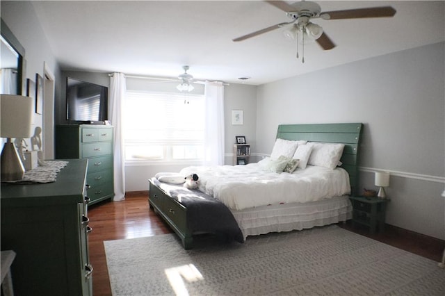 bedroom featuring dark wood-type flooring and ceiling fan