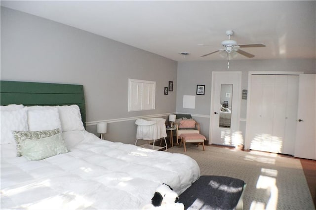 bedroom with a ceiling fan and a closet