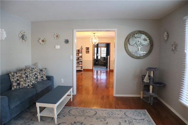 living room with baseboards and wood finished floors