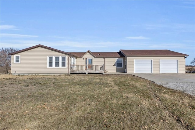 single story home featuring a wooden deck and a front lawn